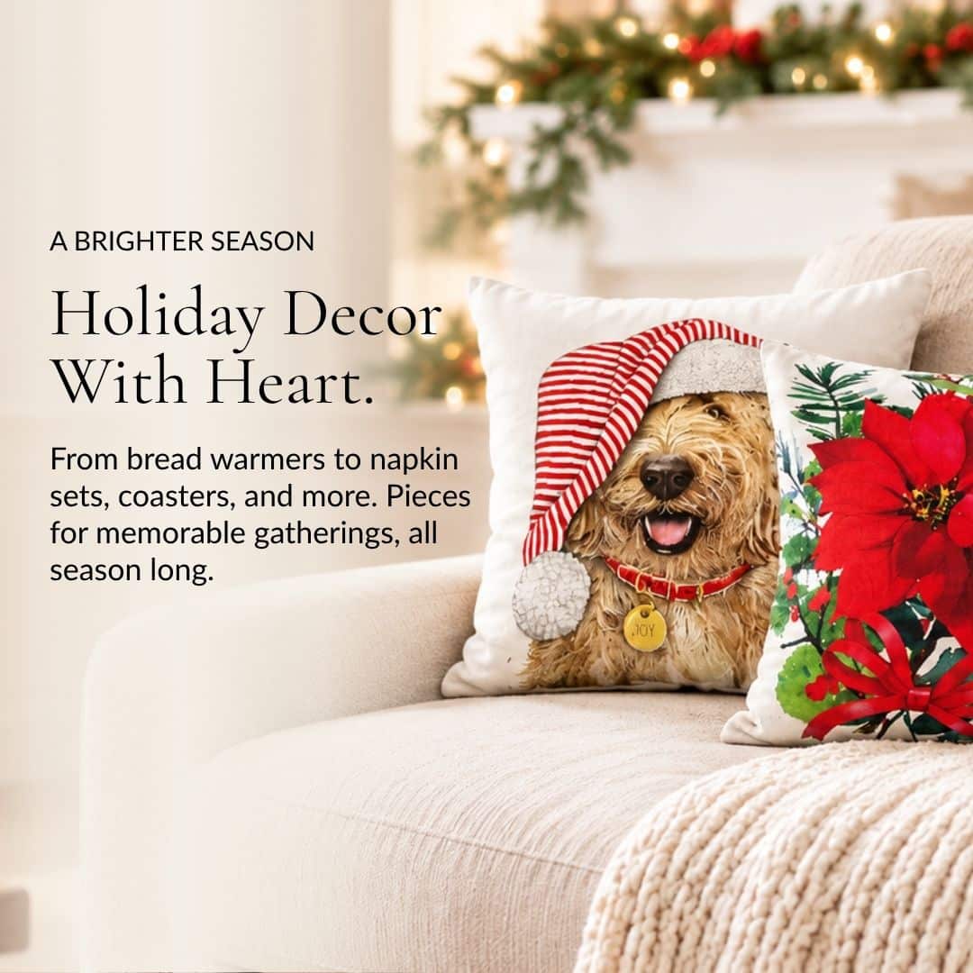 Holiday Décor With Heart. Holiday pillows with a dog in a Santa hat and red poinsettias on a sofa.