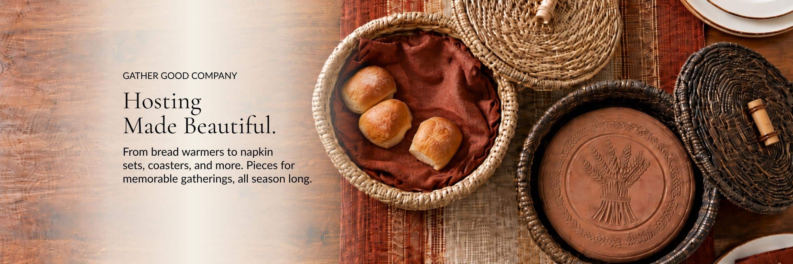 Hosting Made Beautiful. Woven bread warmers with rolls and terracotta warming stones on a table.