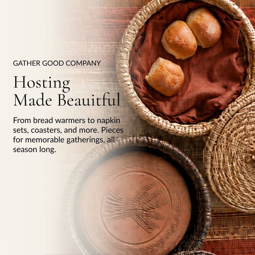 Hosting Made Beautiful. Bread rolls in a woven basket above a terracotta bread-warming stone.